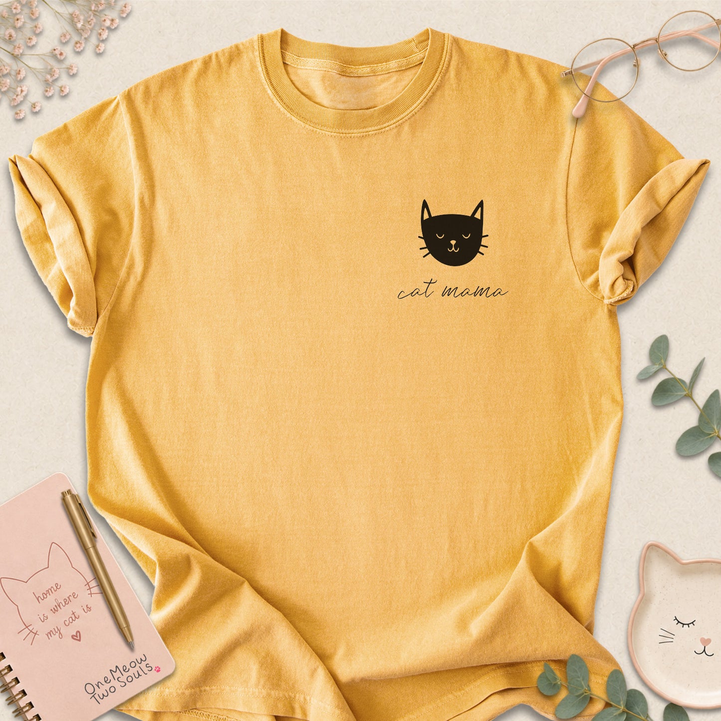 Mustard colored Comfort Colors 1717 cotton T-shirt, featuring a "Cat Mama" funny cat design illustration. One Meow Two Souls brand.