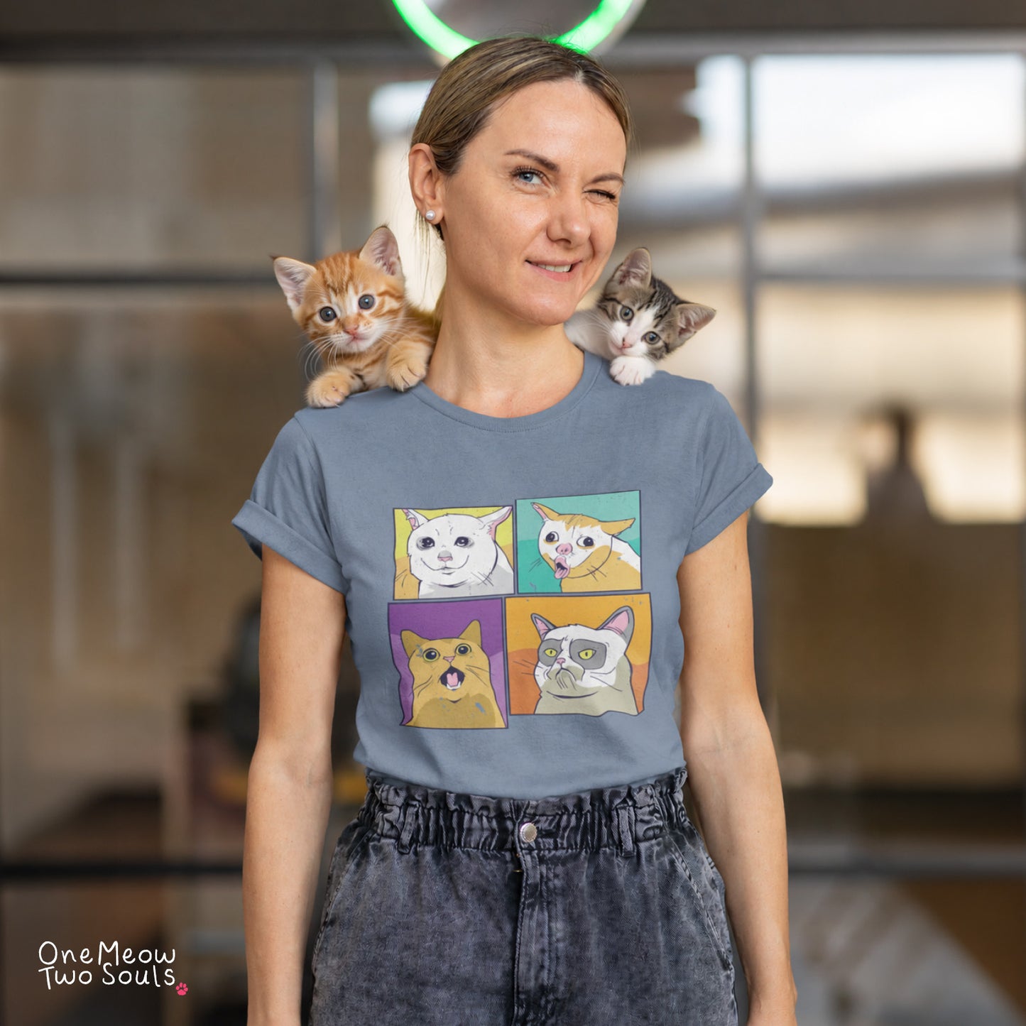 Blue Jean colored Comfort Colors 1717 cotton T-short featuring a colorful Cat Meme faces design. One Meow Two Souls brand.