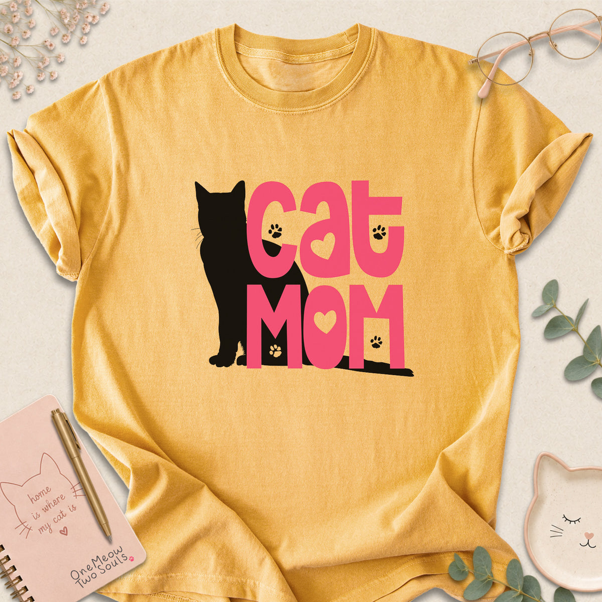 Mustard colored Comfort Colors 1717 cotton T-shirt, featuring a "Cat Mom" funny cat design illustration. One Meow Two Souls brand.