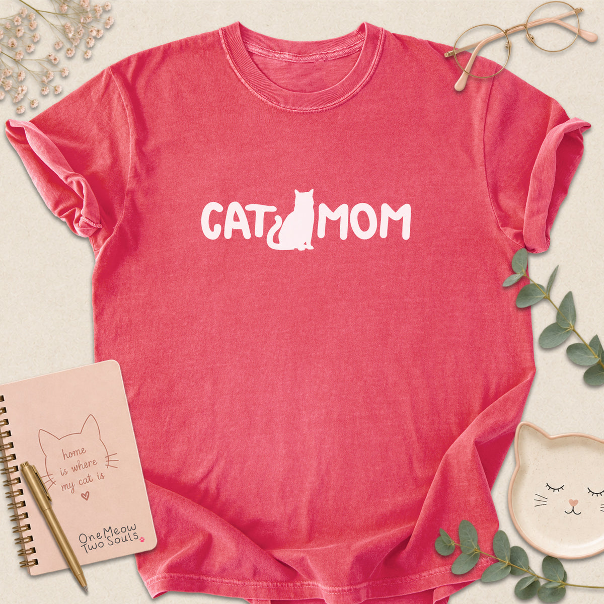 Watermelon Comfort Colors 1717 t-shirt with a white graphic reading 'CAT MOM'. One Meow Two Souls brand.