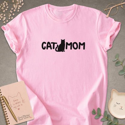 Blossom Comfort Colors 1717 t-shirt with a white graphic reading 'CAT MOM'. One Meow Two Souls brand.