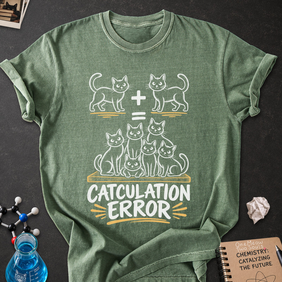 Moss colored Comfort Colors 1717 cotton T-shirt, featuring a "Catculation Error" funny cat design illustration. One Meow Two Souls brand.