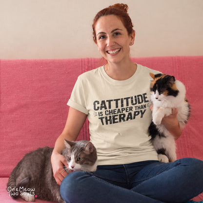 Ivory colored Comfort Colors 1717 cotton T-shirt, featuring a "Cattitude Is Cheaper Than Therapy" funny cat design illustration. One Meow Two Souls brand.