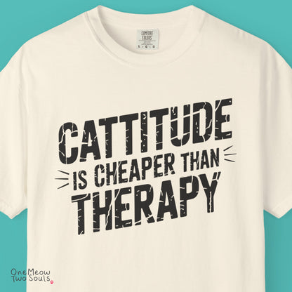 Ivory colored Comfort Colors 1717 cotton T-shirt, featuring a "Cattitude Is Cheaper Than Therapy" funny cat design illustration. One Meow Two Souls brand.