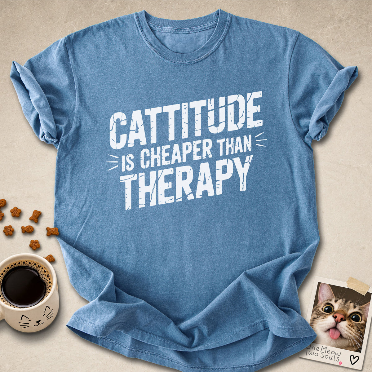 Blue Jean colored Comfort Colors 1717 cotton T-shirt, featuring a "Cattitude Is Cheaper Than Therapy" funny cat design illustration. One Meow Two Souls brand.