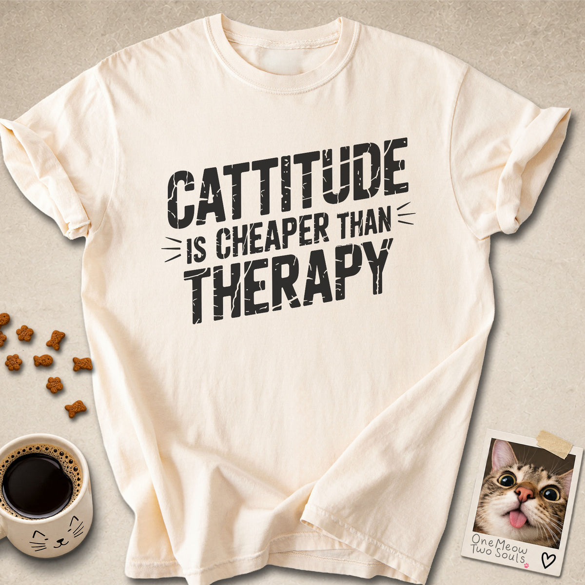 Ivory colored Comfort Colors 1717 cotton T-shirt, featuring a "Cattitude Is Cheaper Than Therapy" funny cat design illustration. One Meow Two Souls brand.