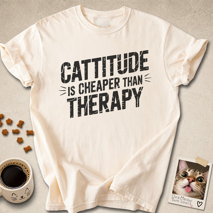 Ivory colored Comfort Colors 1717 cotton T-shirt, featuring a "Cattitude Is Cheaper Than Therapy" funny cat design illustration. One Meow Two Souls brand.