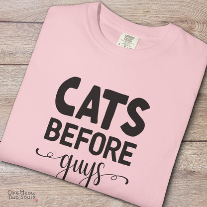 Blossom colored Comfort Colors 1717 cotton T-shirt, featuring a "Cats Before Guys" funny cat design illustration. One Meow Two Souls brand.