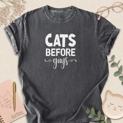 Pepper colored Comfort Colors 1717 cotton T-shirt, featuring a "Cats Before Guys" funny cat design illustration. One Meow Two Souls brand.