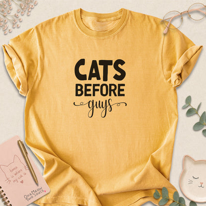 Mustard colored Comfort Colors 1717 cotton T-shirt, featuring a "Cats Before Guys" funny cat design illustration. One Meow Two Souls brand.