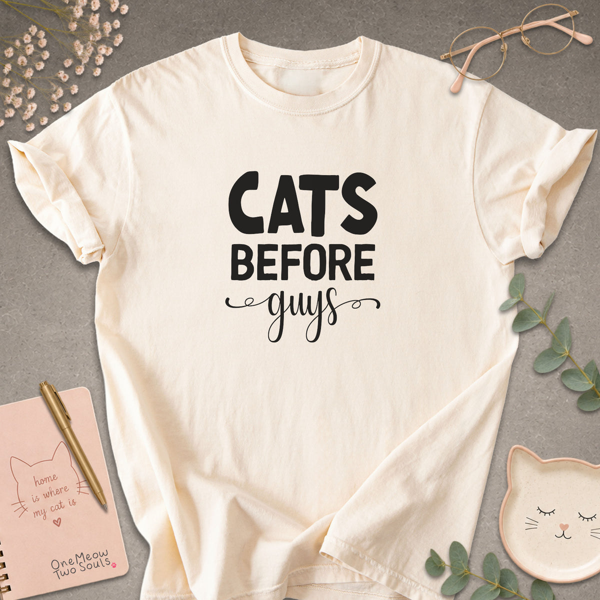 Ivory colored Comfort Colors 1717 cotton T-shirt, featuring a "Cats Before Guys" funny cat design illustration. One Meow Two Souls brand.