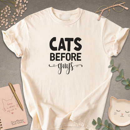 Ivory colored Comfort Colors 1717 cotton T-shirt, featuring a "Cats Before Guys" funny cat design illustration. One Meow Two Souls brand.