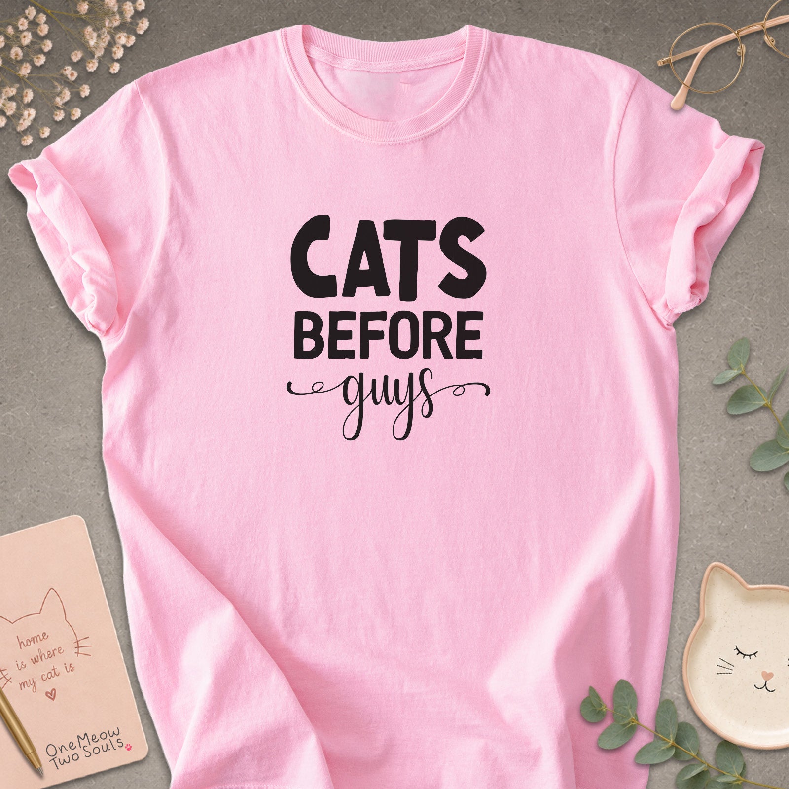 Blossom colored Comfort Colors 1717 cotton T-shirt, featuring a "Cats Before Guys" funny cat design illustration. One Meow Two Souls brand.