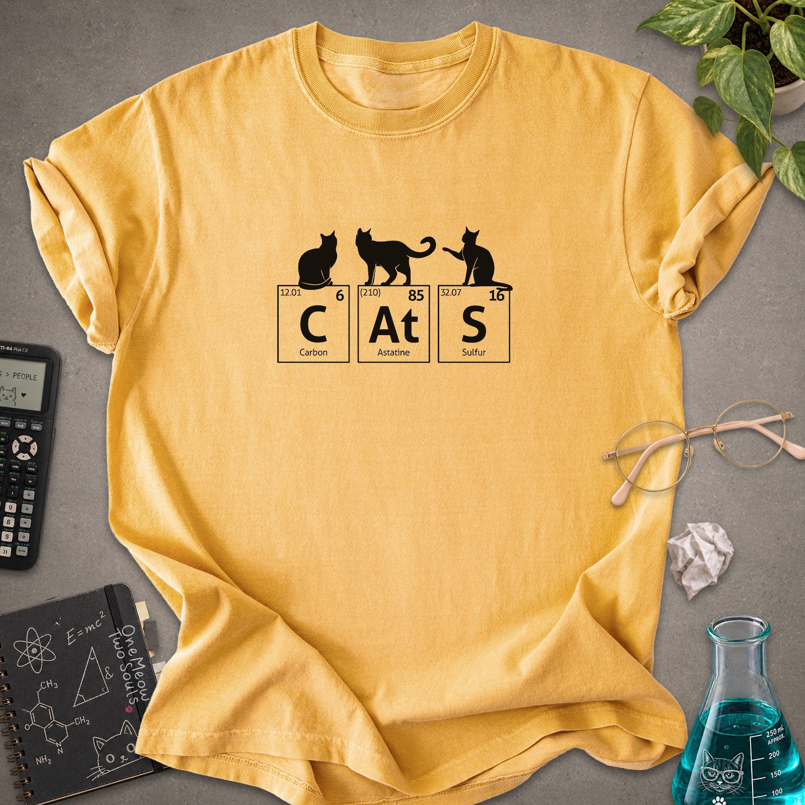 Mustard colored Comfort Colors 1717 cotton T-shirt, presenting a "CatS" funny chemistry periodic table cat design. One Meow Two Souls brand.