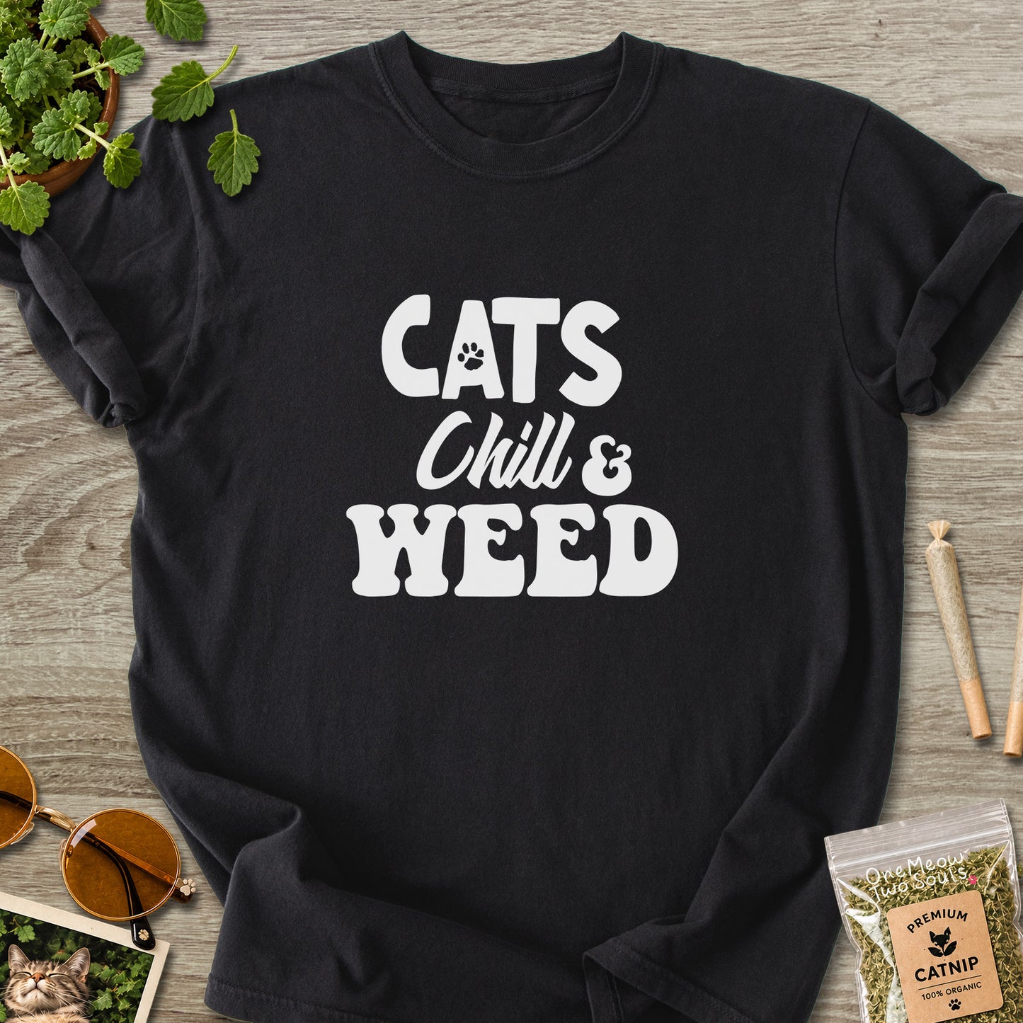 Black colored Comfort Colors 1717 cotton T-shirt, featuring a "Cats, Chill and Weed" funny cat design illustration. One Meow Two Souls brand.