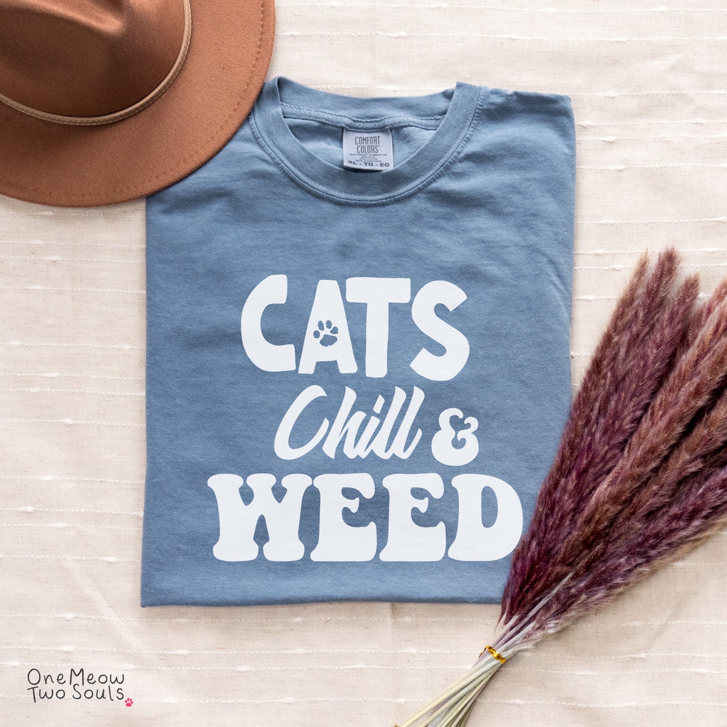 Blue Jean colored Comfort Colors 1717 cotton T-shirt, featuring a "Cats, Chill and Weed" funny cat design illustration. One Meow Two Souls brand.