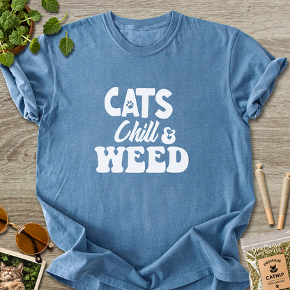 Blue jean colored Comfort Colors 1717 cotton T-shirt, featuring a "Cats, Chill and Weed" funny cat design illustration. One Meow Two Souls brand.