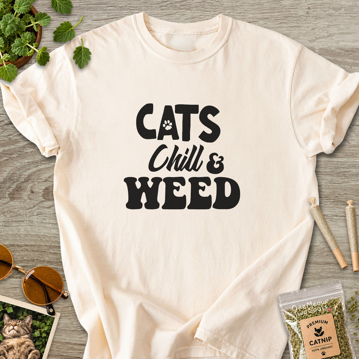 Ivory colored Comfort Colors 1717 cotton T-shirt, featuring a "Cats, Chill and Weed" funny cat design illustration. One Meow Two Souls brand.