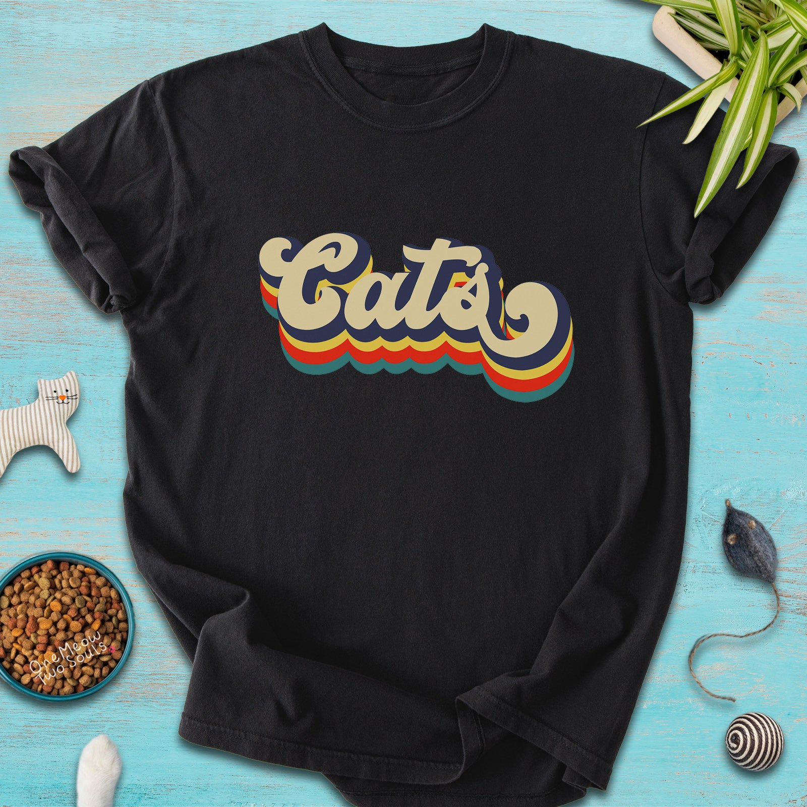 Black colored Comfort Colors 1717 t-shirt with a retro "Cats" typography design. Onw Meow Two Sould brand.