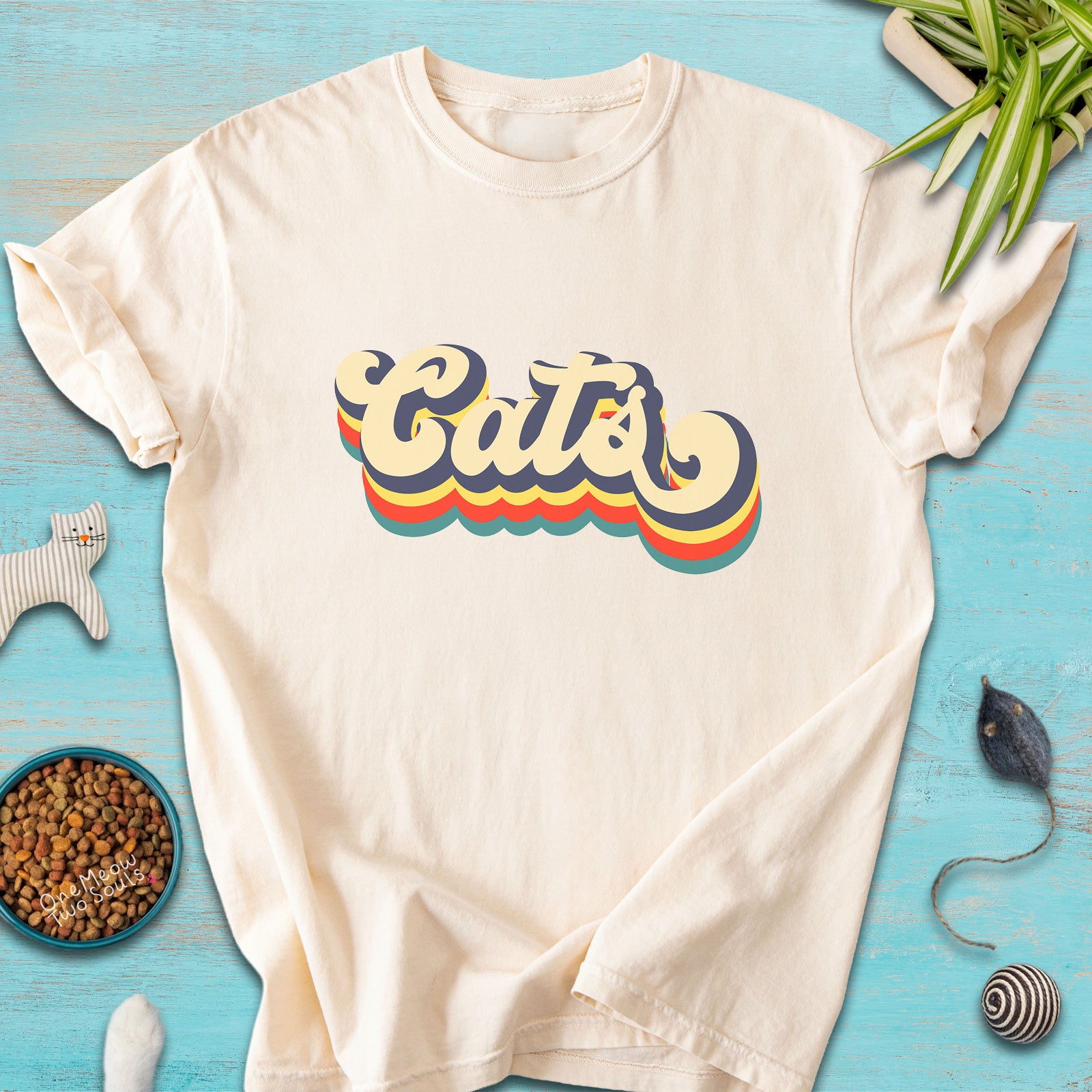 Ivory colored Comfort Colors 1717 t-shirt with a retro "Cats" typography design. Onw Meow Two Sould brand.