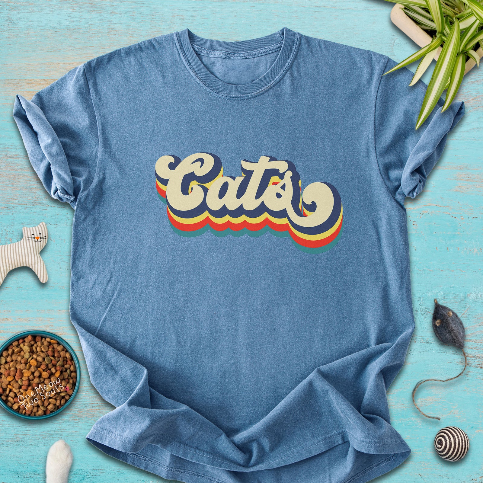 Blue Jean colored Comfort Colors 1717 t-shirt with a retro "Cats" typography design. Onw Meow Two Sould brand.