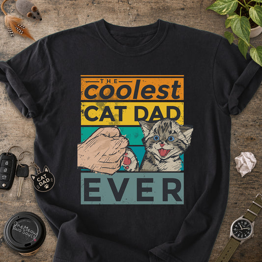 Black colored Comfort Colors 1717 T-shirt with a "The Coolest Cat Dad Ever" colorful retro design. One Meow Two Souls brand.