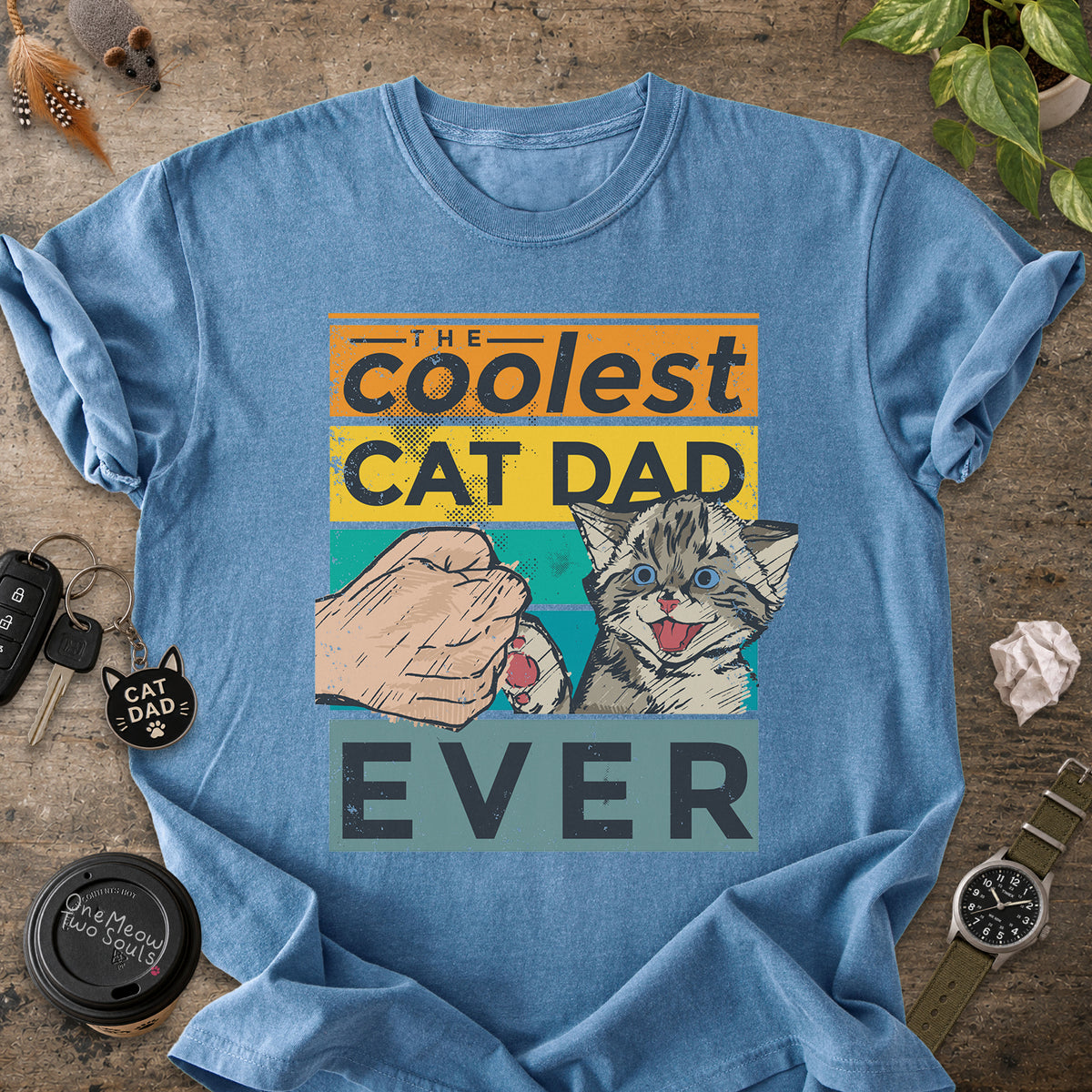 Blue Jean colored Comfort Colors 1717 T-shirt with a "The Coolest Cat Dad Ever" colorful retro design. One Meow Two Souls brand.
