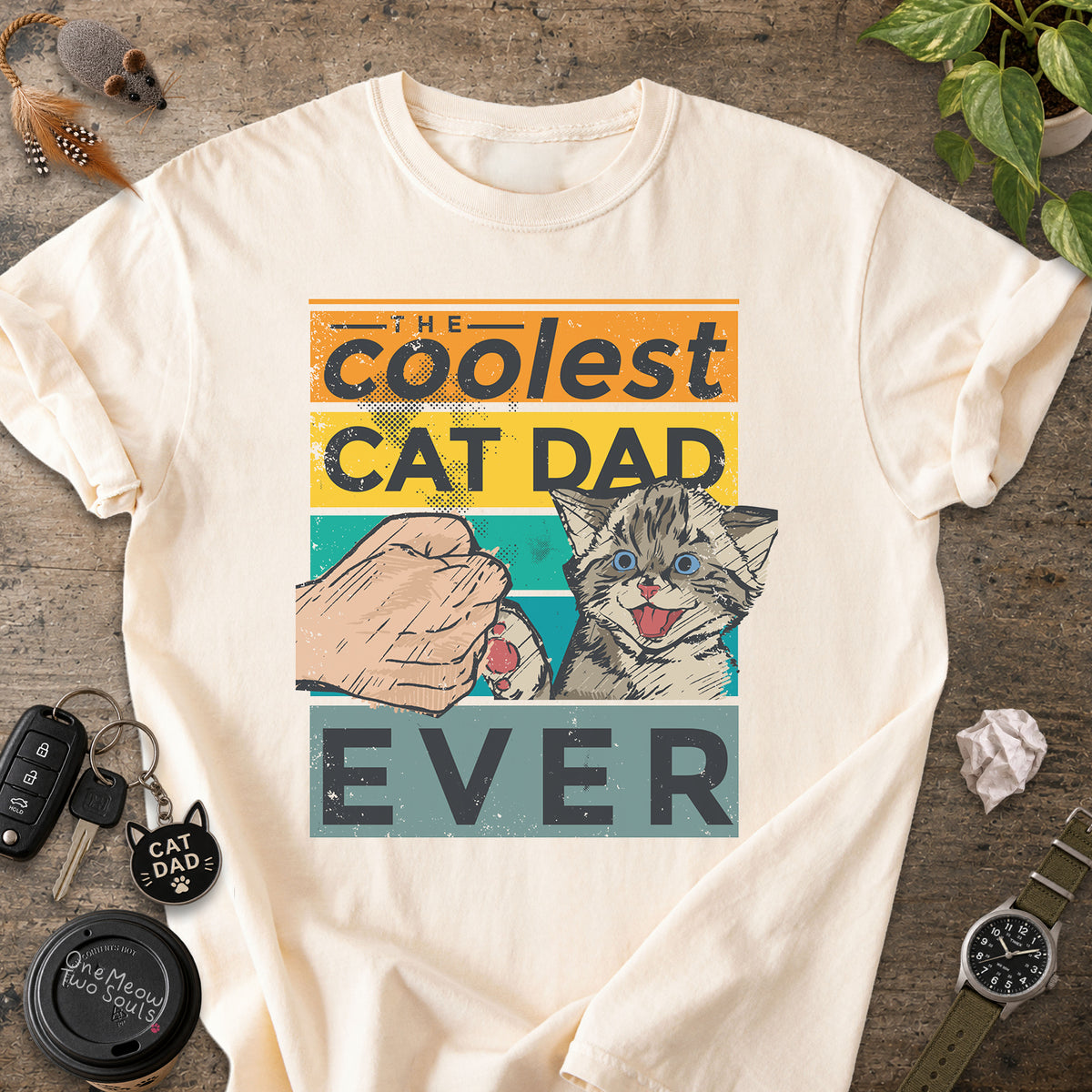 Ivory colored Comfort Colors 1717 T-shirt with a "The Coolest Cat Dad Ever" colorful retro design. One Meow Two Souls brand.