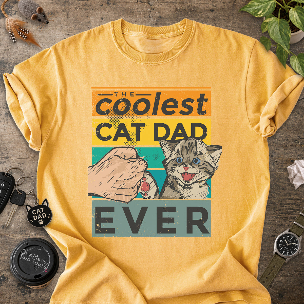Mustard colored Comfort Colors 1717 T-shirt with a "The Coolest Cat Dad Ever" colorful retro design. One Meow Two Souls brand.