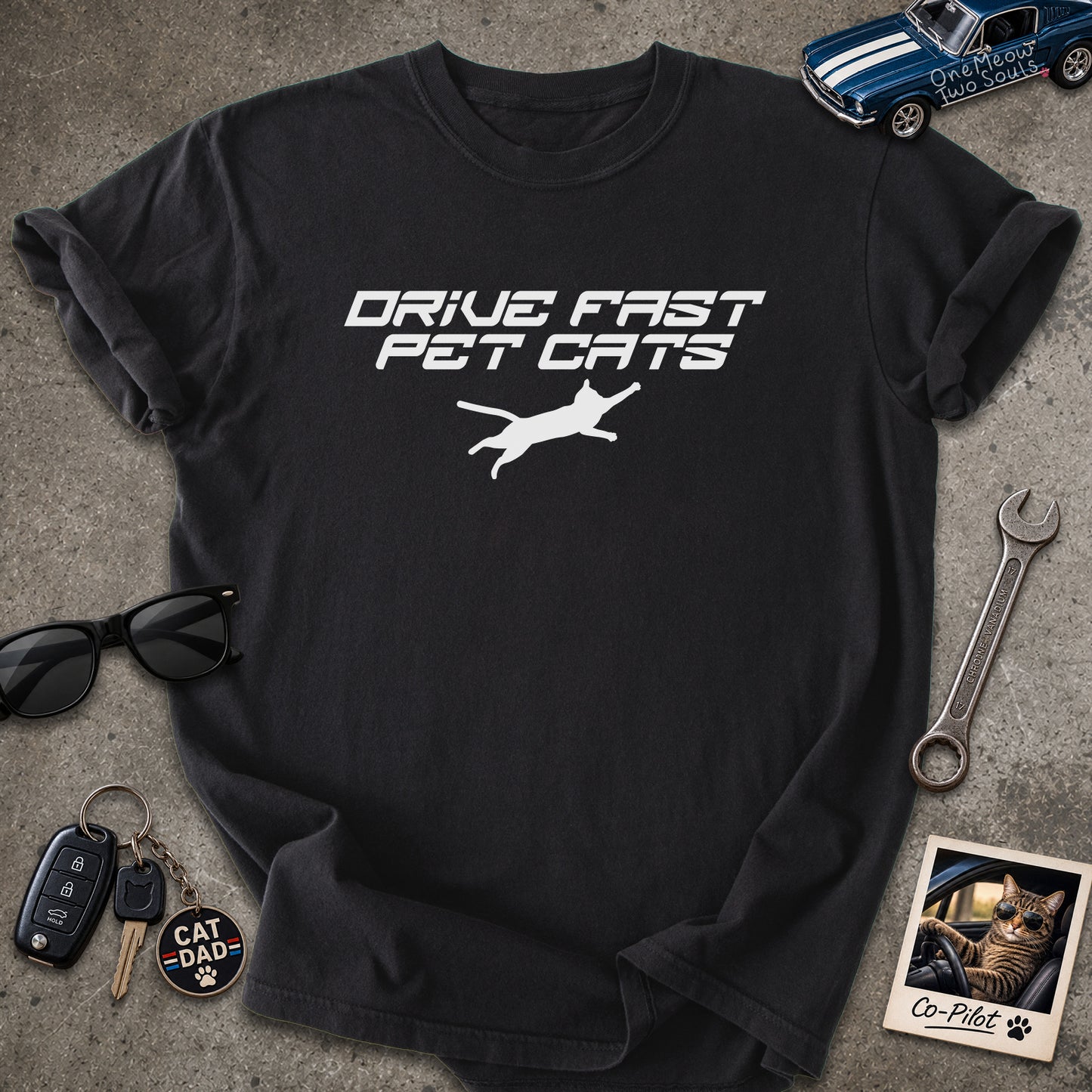 Black color Comfort Colors 1717 t-shirt with a "Drive Fast Pet Cats" design. Aimed for Cat dads and men who love cats. One Meow Two Souls brand.