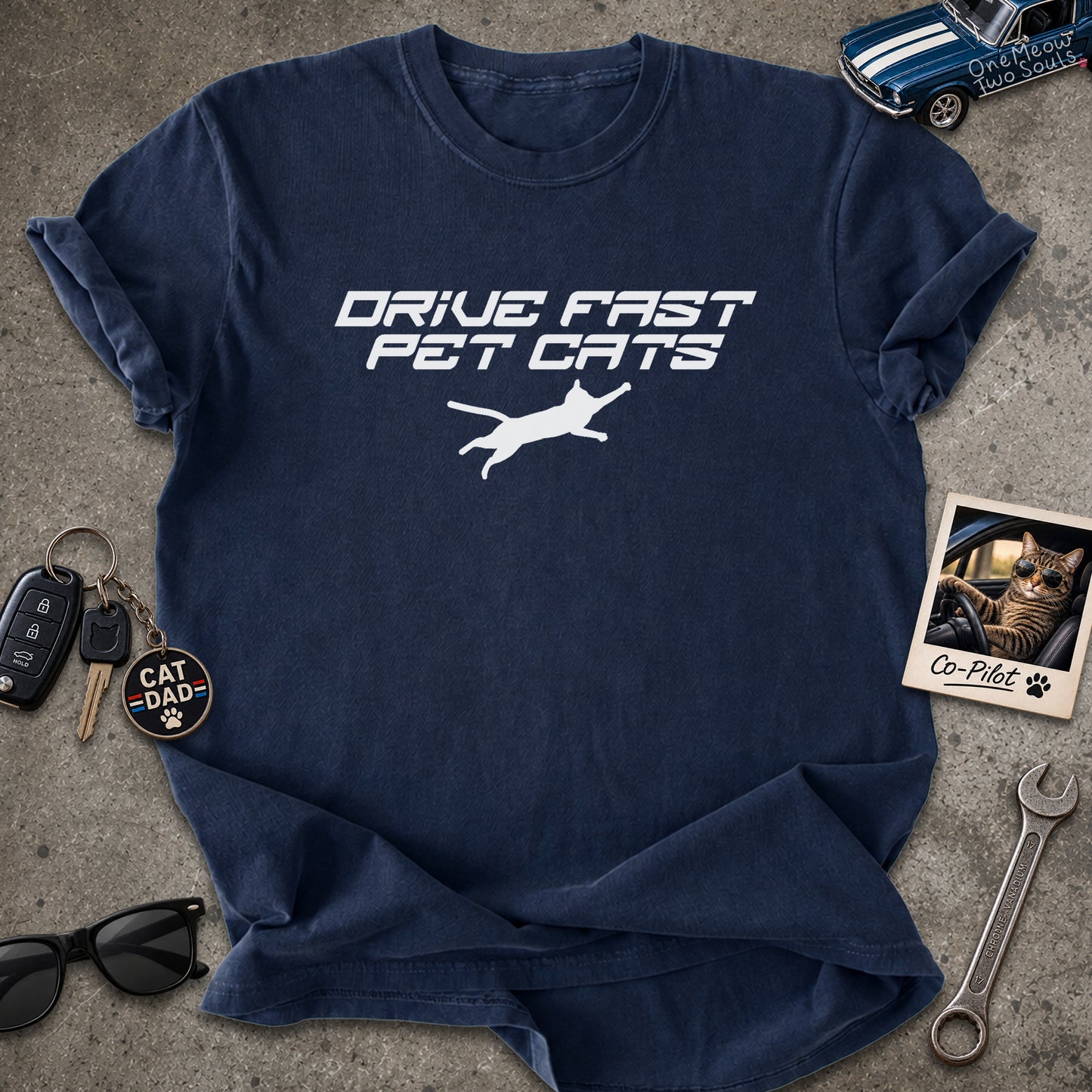Navy color Comfort Colors 1717 t-shirt with a "Drive Fast Pet Cats" design. Aimed for Cat dads and men who love cats. One Meow Two Souls brand.