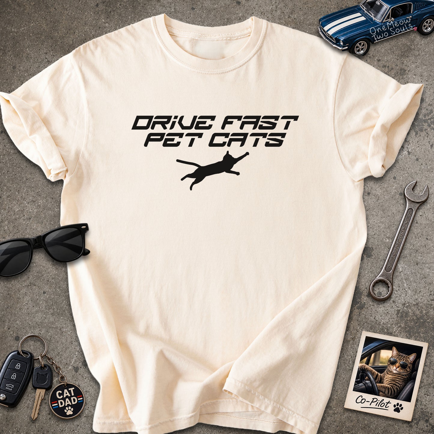 Ivory color Comfort Colors 1717 t-shirt with a "Drive Fast Pet Cats" design. Aimed for Cat dads and men who love cats. One Meow Two Souls brand.