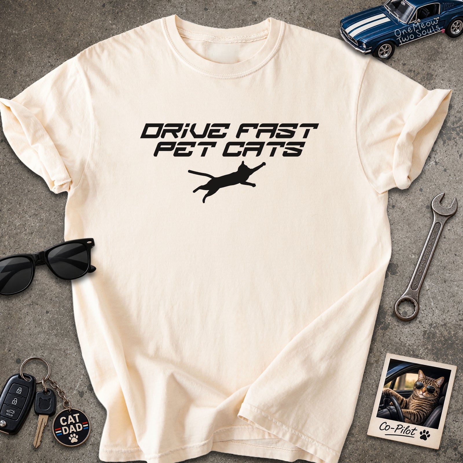 Ivory color Comfort Colors 1717 t-shirt with a "Drive Fast Pet Cats" design. Aimed for Cat dads and men who love cats. One Meow Two Souls brand.