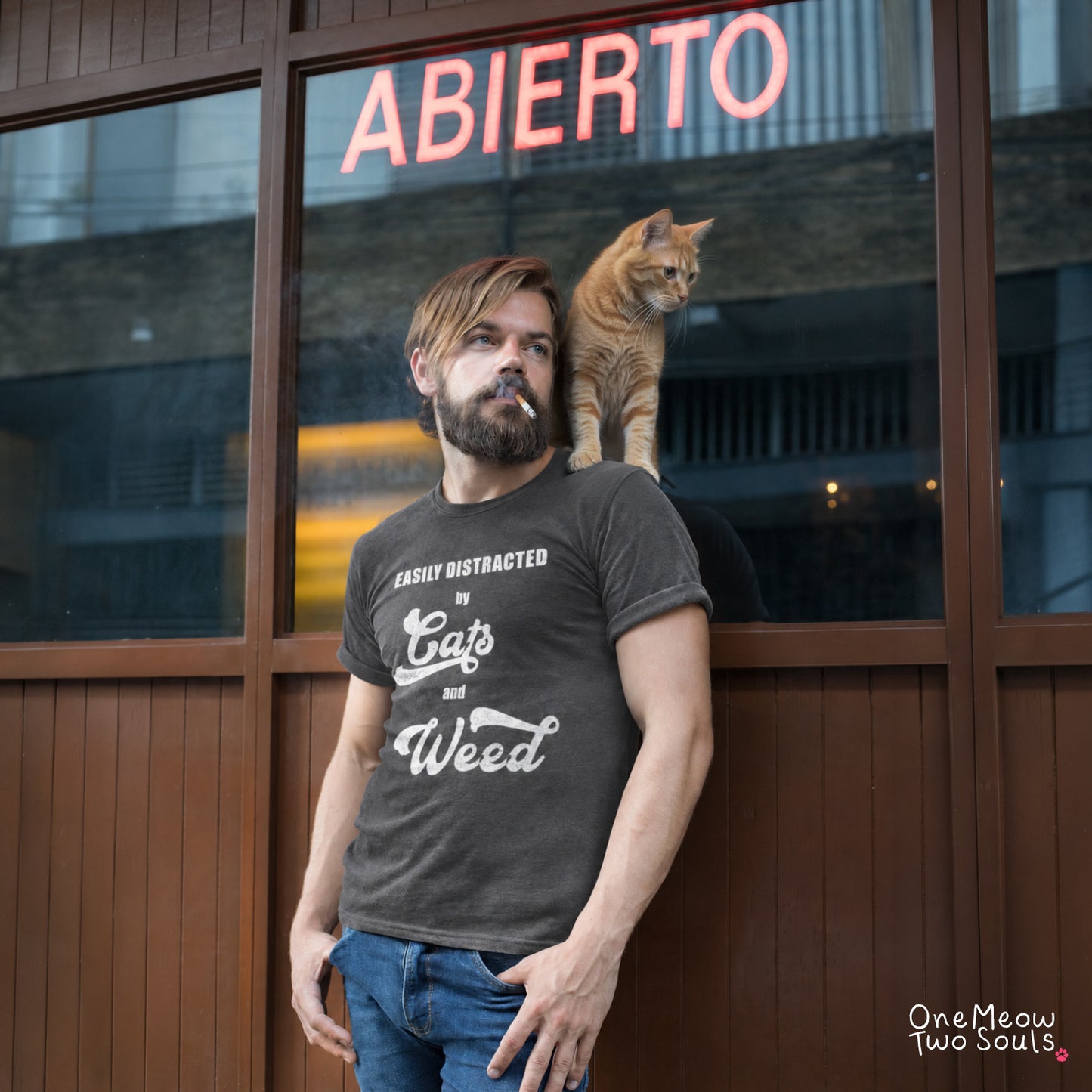 Pepper colored Comfort Colors 1717 cotton T-shirt, featuring a "Easily Distracted by Cats and Weed" funny cat design illustration. One Meow Two Souls brand.