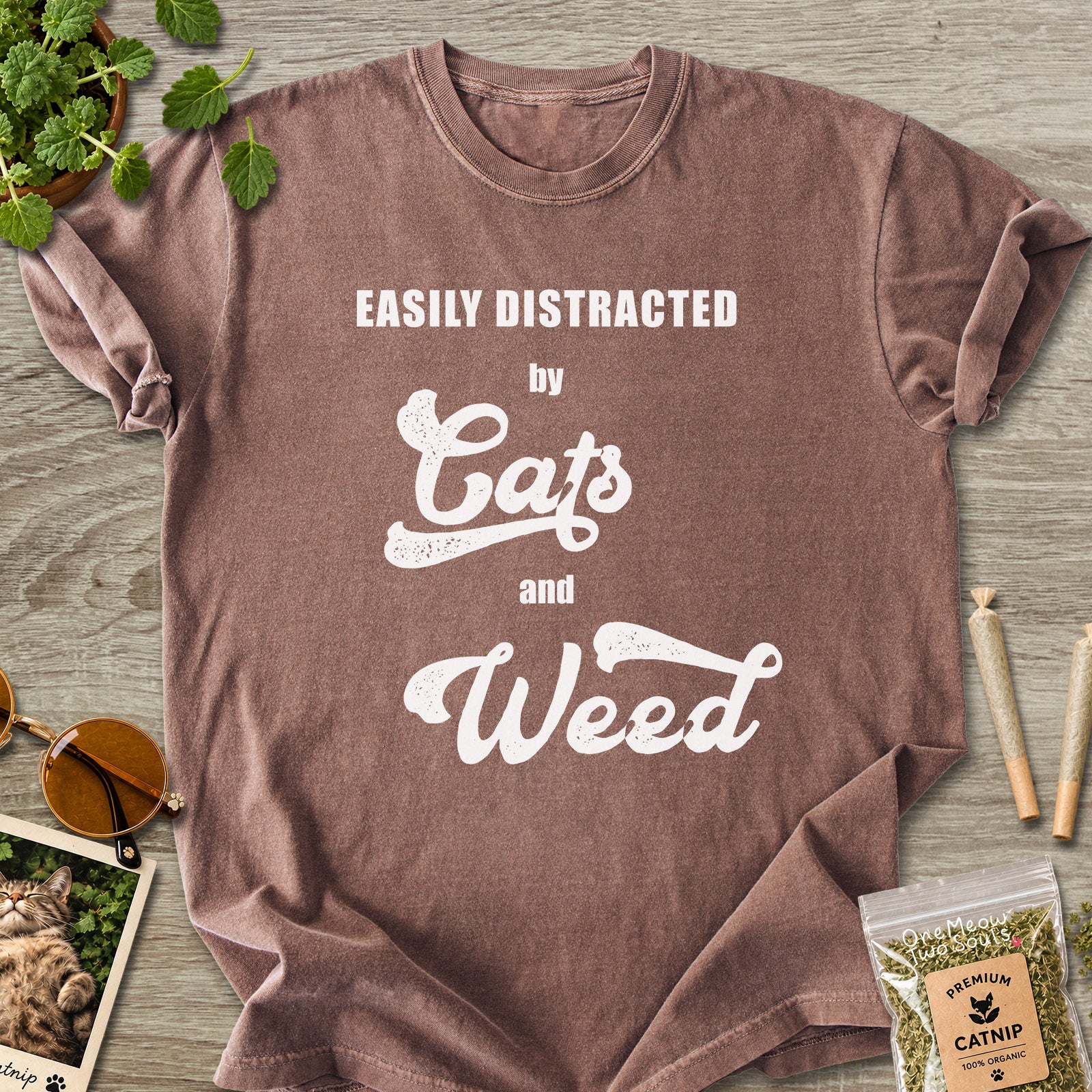 Espresso colored Comfort Colors 1717 cotton T-shirt, featuring a "Easily Distracted by Cats and Weed" funny cat design illustration. One Meow Two Souls brand.