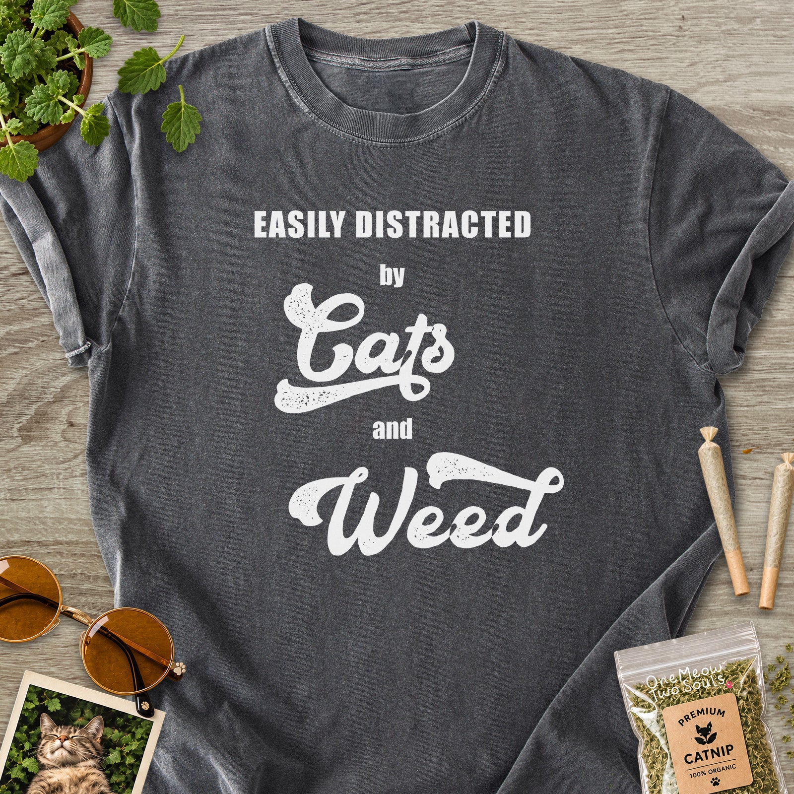 Pepper colored Comfort Colors 1717 cotton T-shirt, featuring a "Easily Distracted by Cats and Weed" funny cat design illustration. One Meow Two Souls brand.