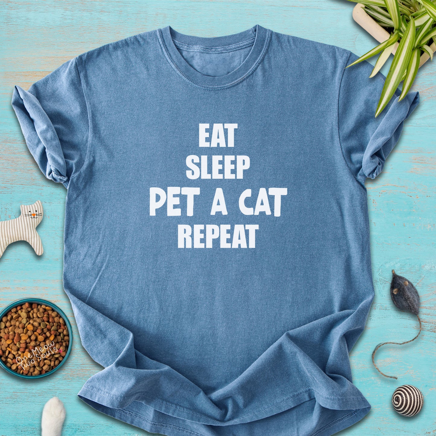 Blue Jean colored Comfort Colors 1717 t-cotton shirt with a "Eat Sleep Pet a Cat Repeat" design. One Meow Two Souls brand.