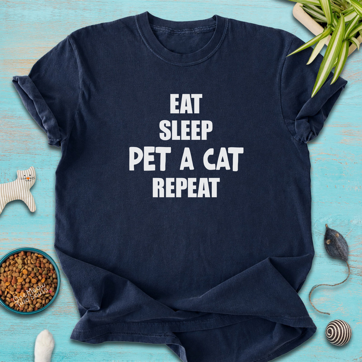 Navy colored Comfort Colors 1717 t-cotton shirt with a "Eat Sleep Pet a Cat Repeat" design. One Meow Two Souls brand.