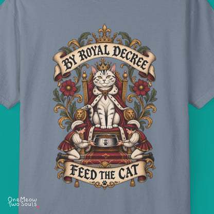 Blue jean colored Comfort Colors 1717 cotton T-shirt, featuring a "By Royal Decree - Feed The Cat" funny cat design illustration. One Meow Two Souls brand.