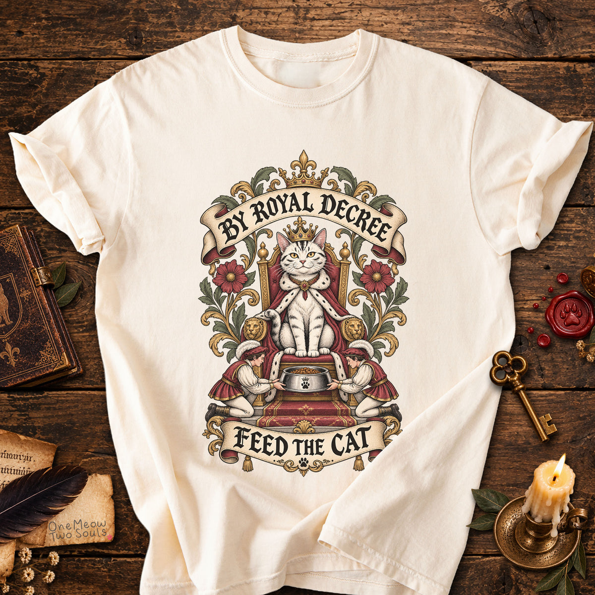 Ivory colored Comfort Colors 1717 cotton T-shirt, featuring a "By Royal Decree - Feed The Cat" funny cat design illustration. One Meow Two Souls brand.