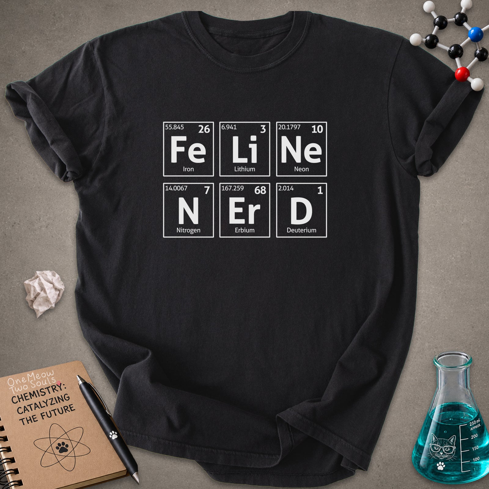 Black color Comfort Colors 1717 T-shirt with a "Feline Nerd" chemitsry periodic table desigh. One Meow Two Souls brand.