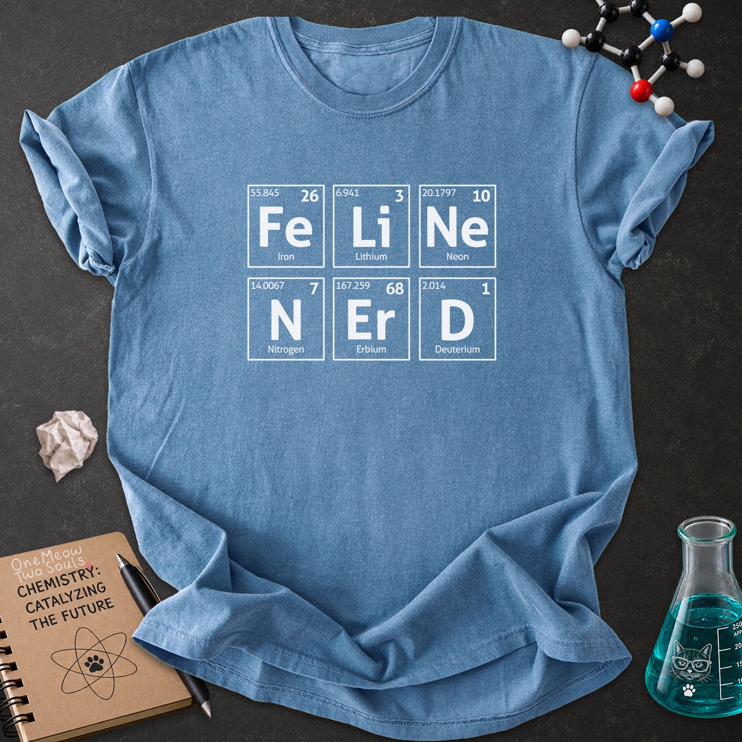 Blue Jean color Comfort Colors 1717 T-shirt with a "Feline Nerd" chemitsry periodic table desigh. One Meow Two Souls brand.