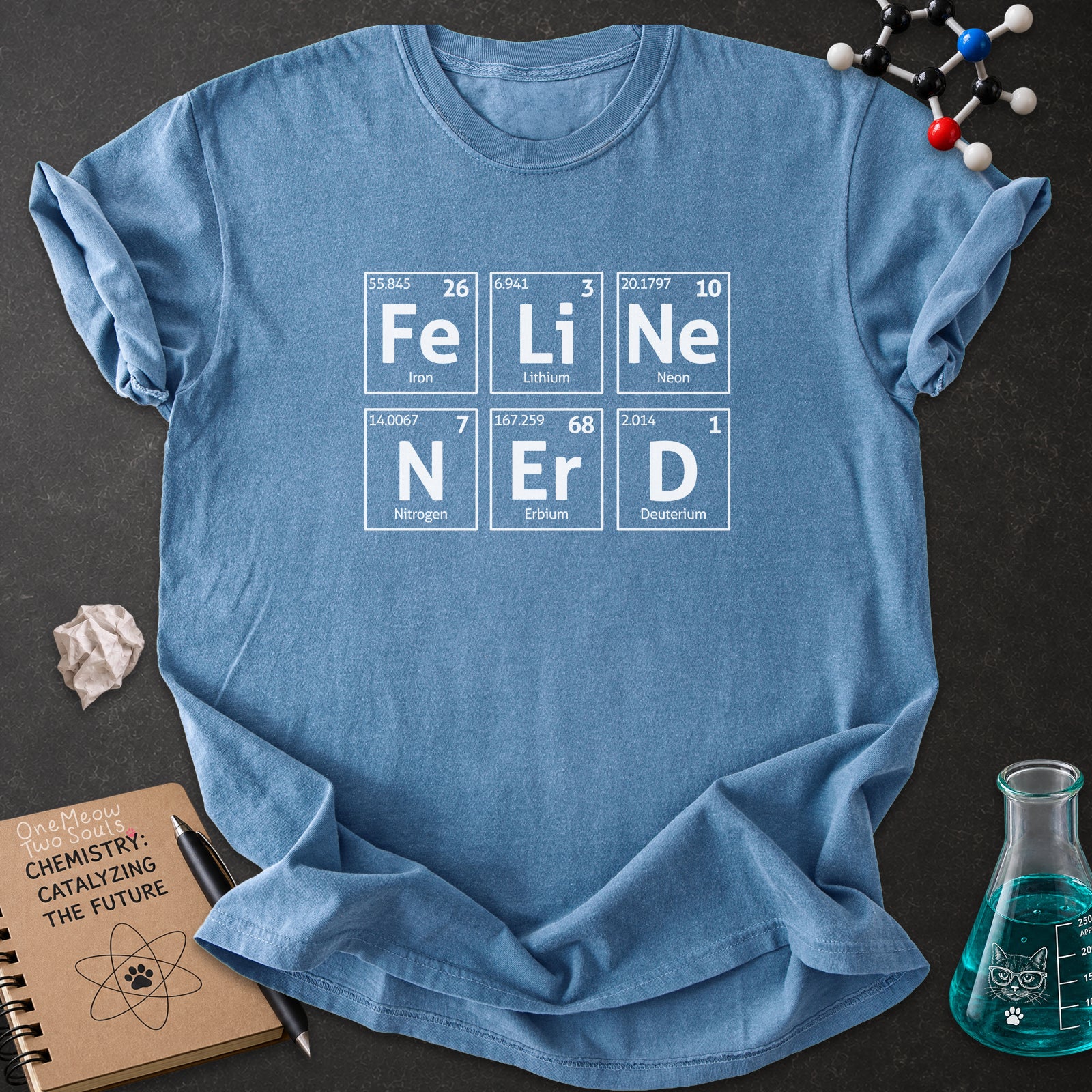 Blue Jean color Comfort Colors 1717 T-shirt with a "Feline Nerd" chemitsry periodic table desigh. One Meow Two Souls brand.