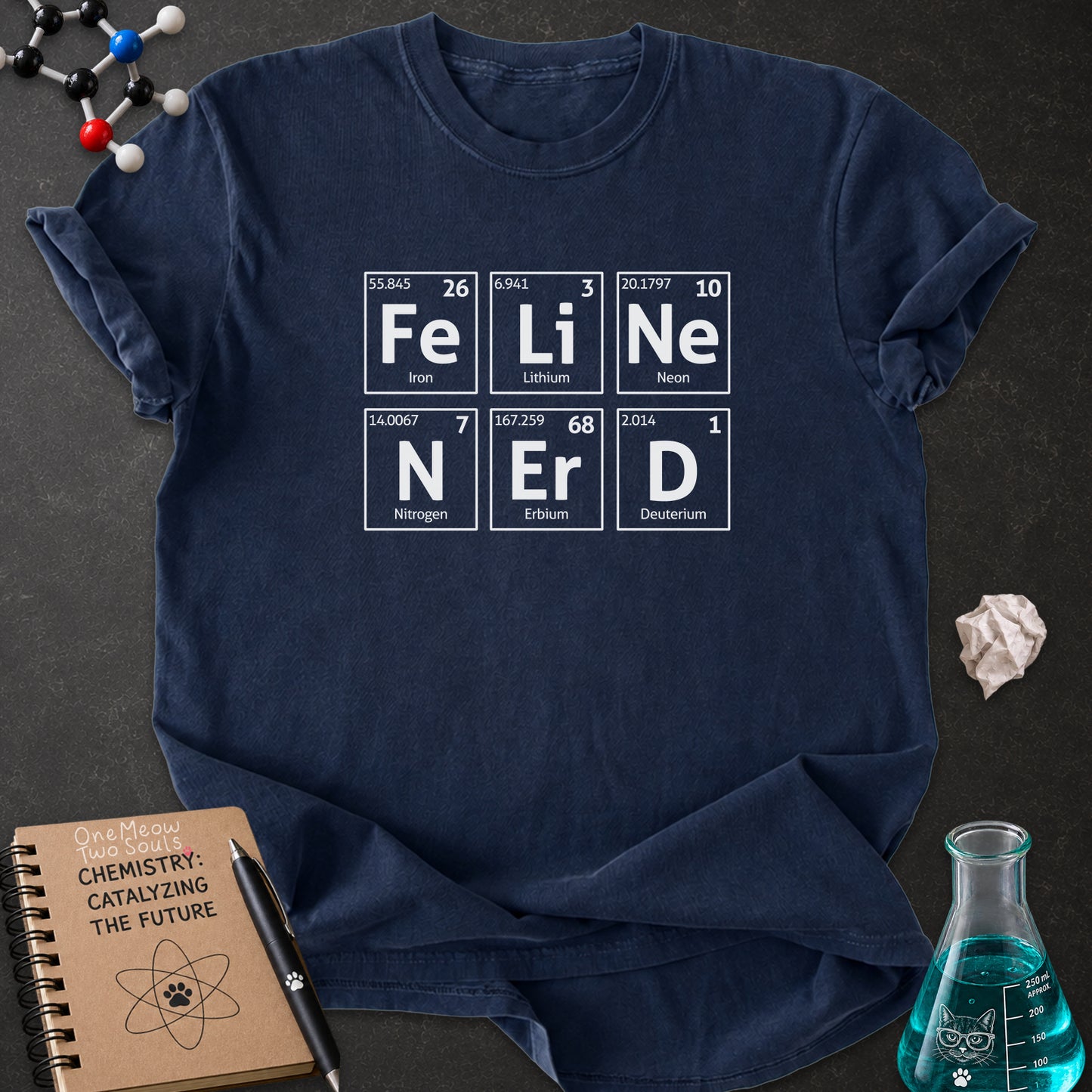 Navy color Comfort Colors 1717 T-shirt with a "Feline Nerd" chemitsry periodic table desigh. One Meow Two Souls brand.