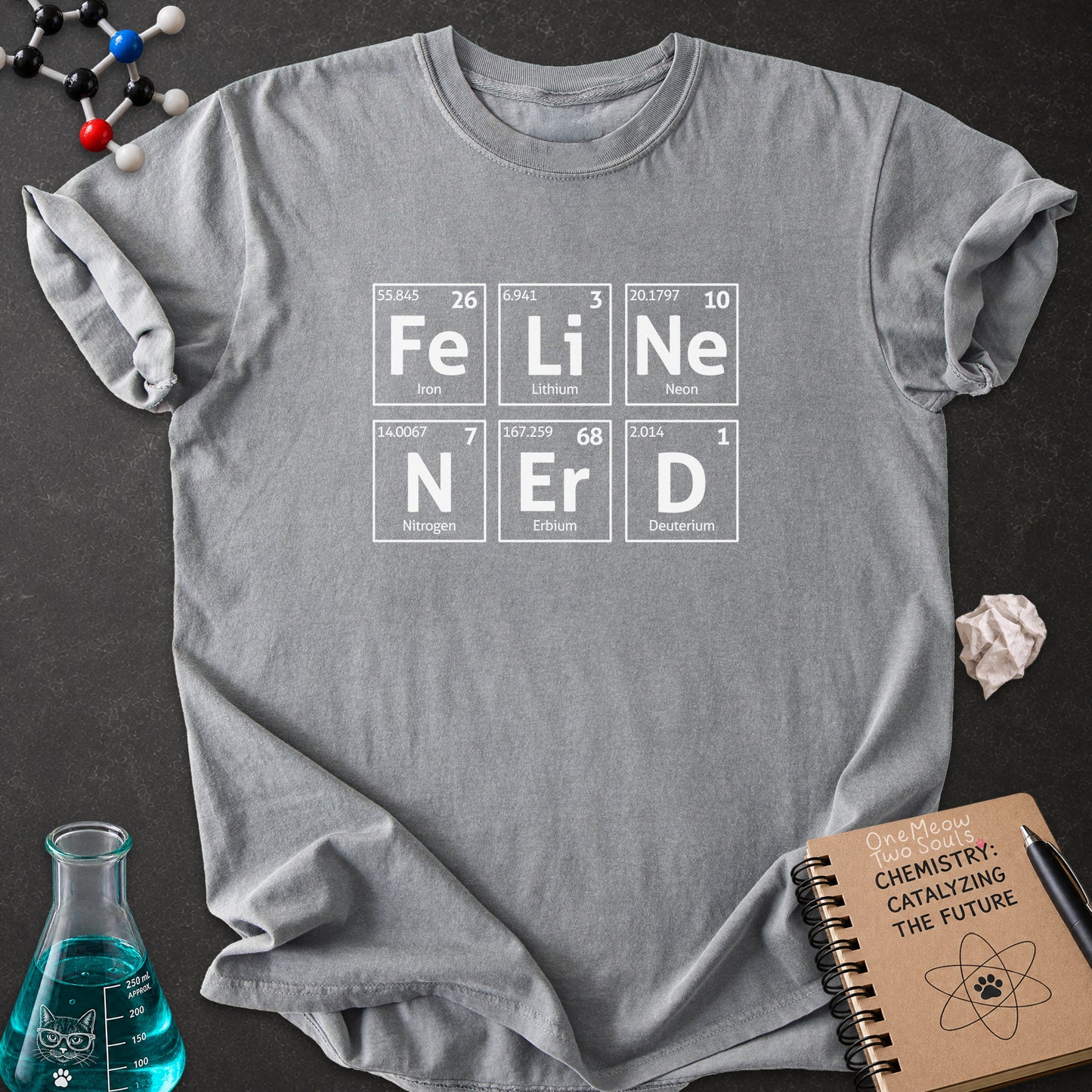 Gray color Comfort Colors 1717 T-shirt with a "Feline Nerd" chemitsry periodic table desigh. One Meow Two Souls brand.