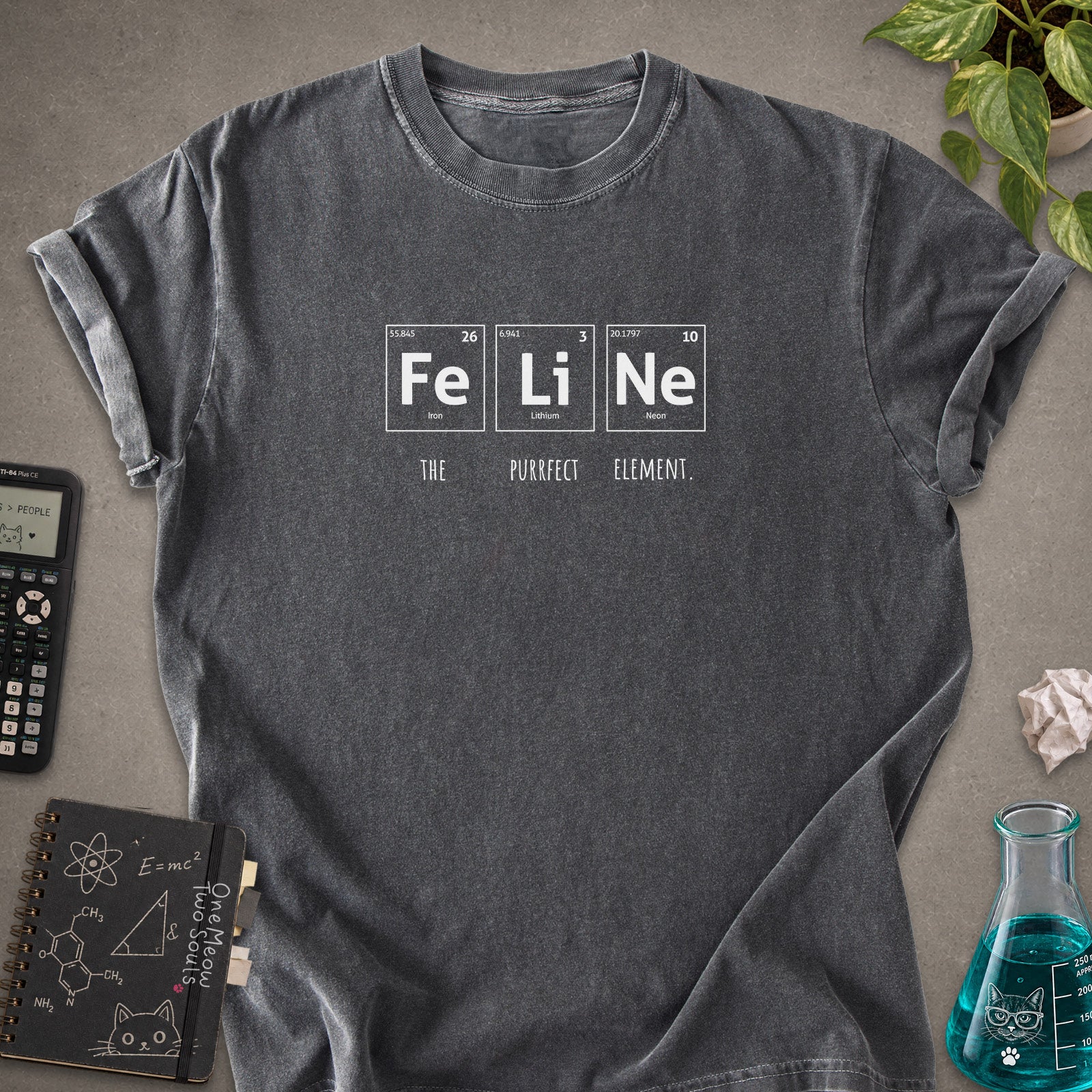 Pepper colored Comfort Colors 1717 cotton T-shirt, presenting a "FeLiNe The Purrfect Lelement" funny Chemistry cat design. One Meow Two Souls brand.