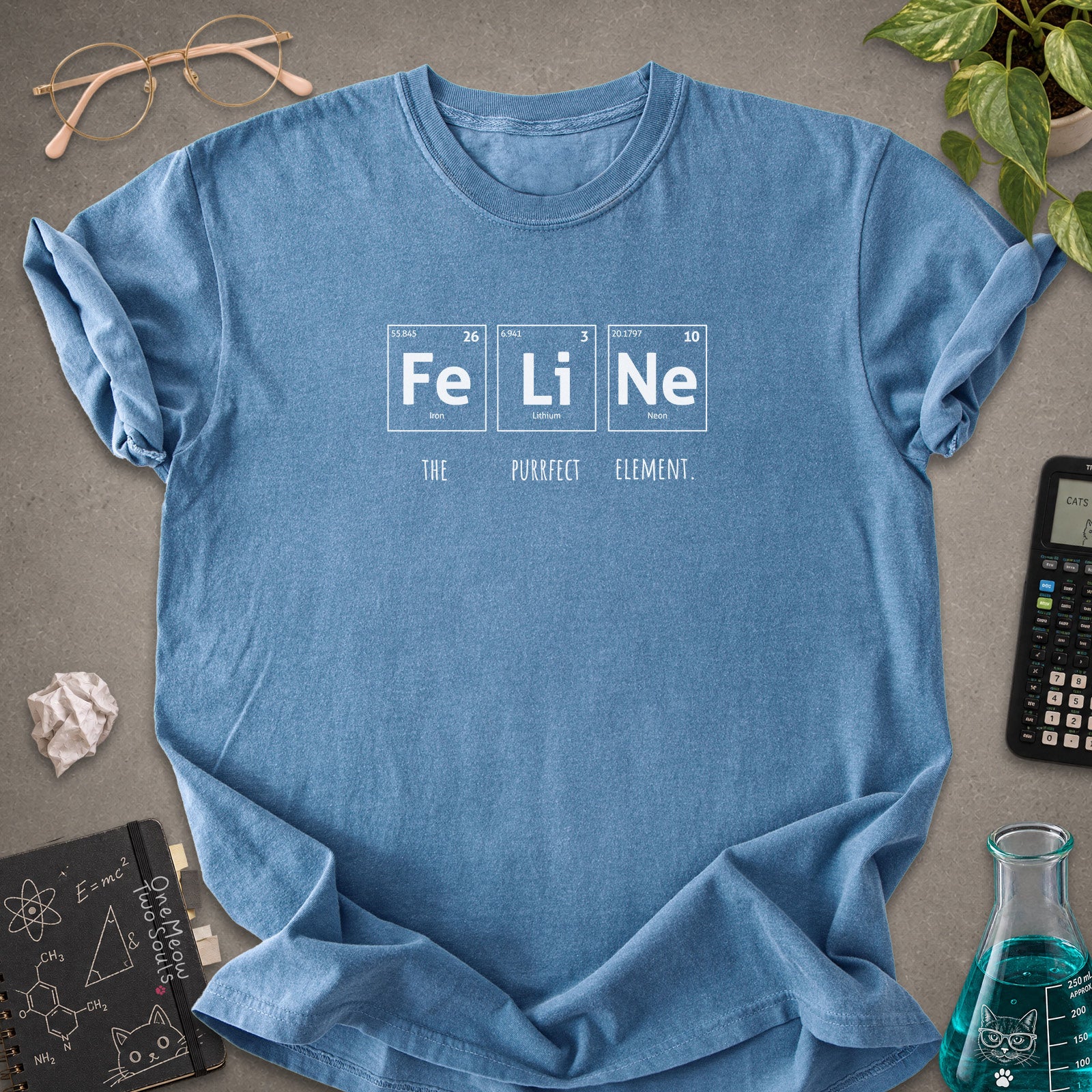 Blue jean colored Comfort Colors 1717 cotton T-shirt, presenting a "FeLiNe The Purrfect Lelement" funny Chemistry cat design. One Meow Two Souls brand.