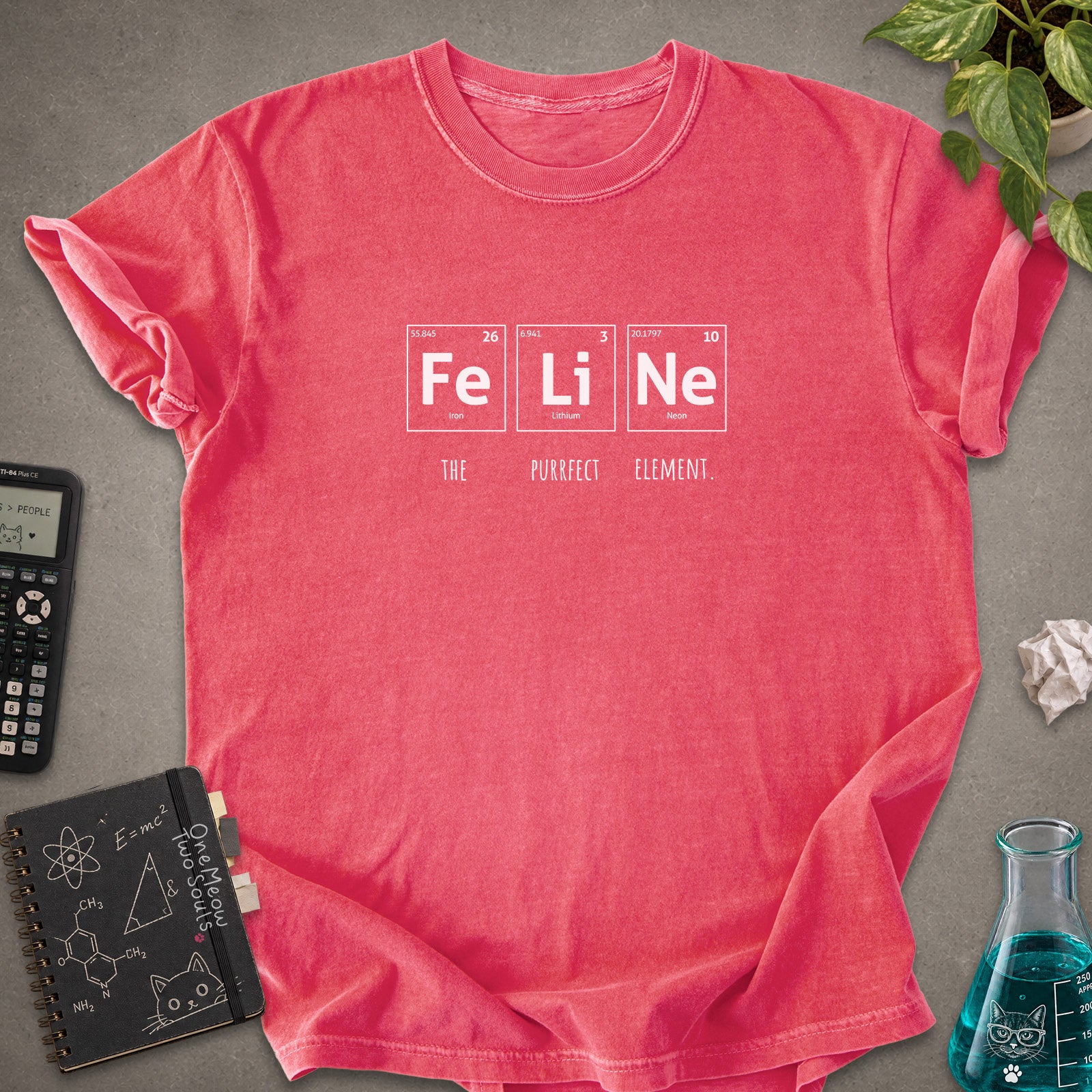Watermelon colored Comfort Colors 1717 cotton T-shirt, presenting a "FeLiNe The Purrfect Lelement" funny Chemistry cat design. One Meow Two Souls brand.