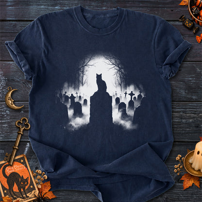 Navy colored Comfort Colors 1717 cotton T-shirt, featuring a spooky graveyard Halloween cat design illustration. One Meow Two Souls brand.