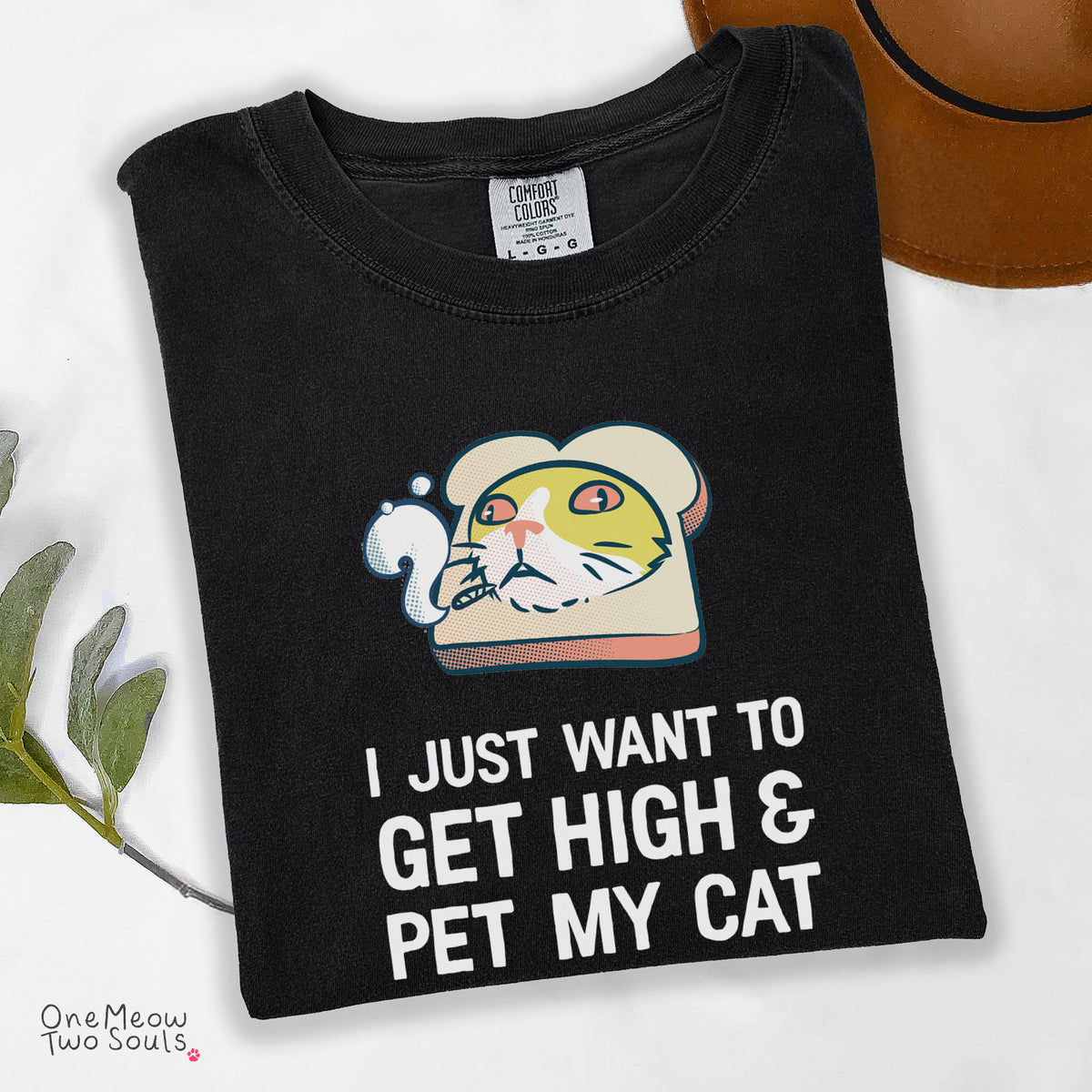 Black colored Comfort Colors 1717 cotton T-shirt, featuring a "I Just Want to Get High and pet My Cat" funny cat design illustration. One Meow Two Souls brand.